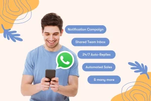 A person in a blue shirt smiling at their phone, with messages about notification campaign, shared team inbox, 24/7 auto-replies, and automated sales alongside a WhatsApp icon.