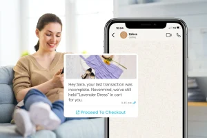 A woman sits on a couch using her phone. A phone screen shows a personalized WhatsApp message reminding her to complete the purchase of a lavender dress left in her shopping cart.